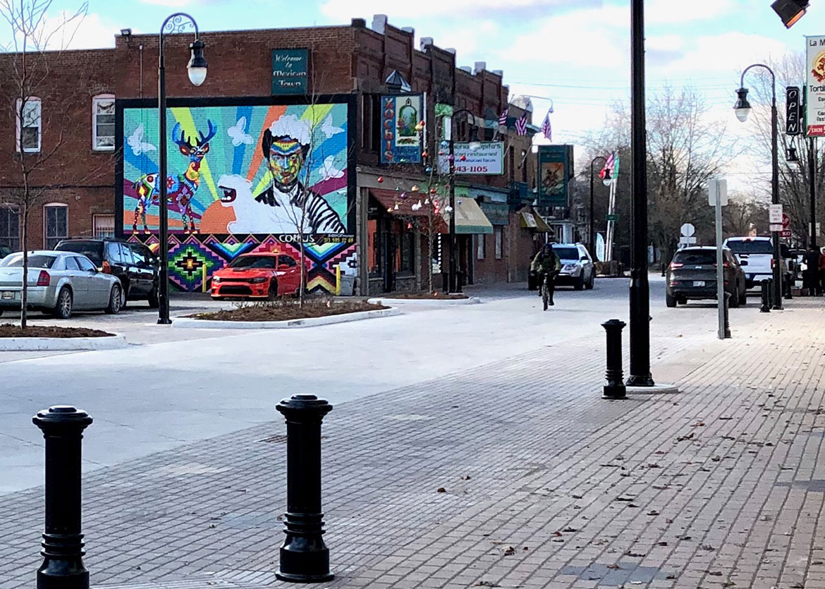 This project provides a shared street experience for the corridor that will include new roadway pavement, underground infrastructure, festoon and traditional lighting, street furniture, brick pavers, and landscaping.