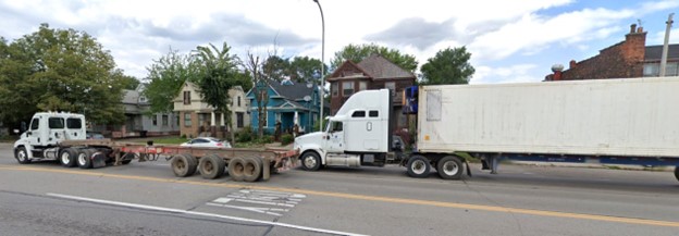semi truck in front of houses in Detroit