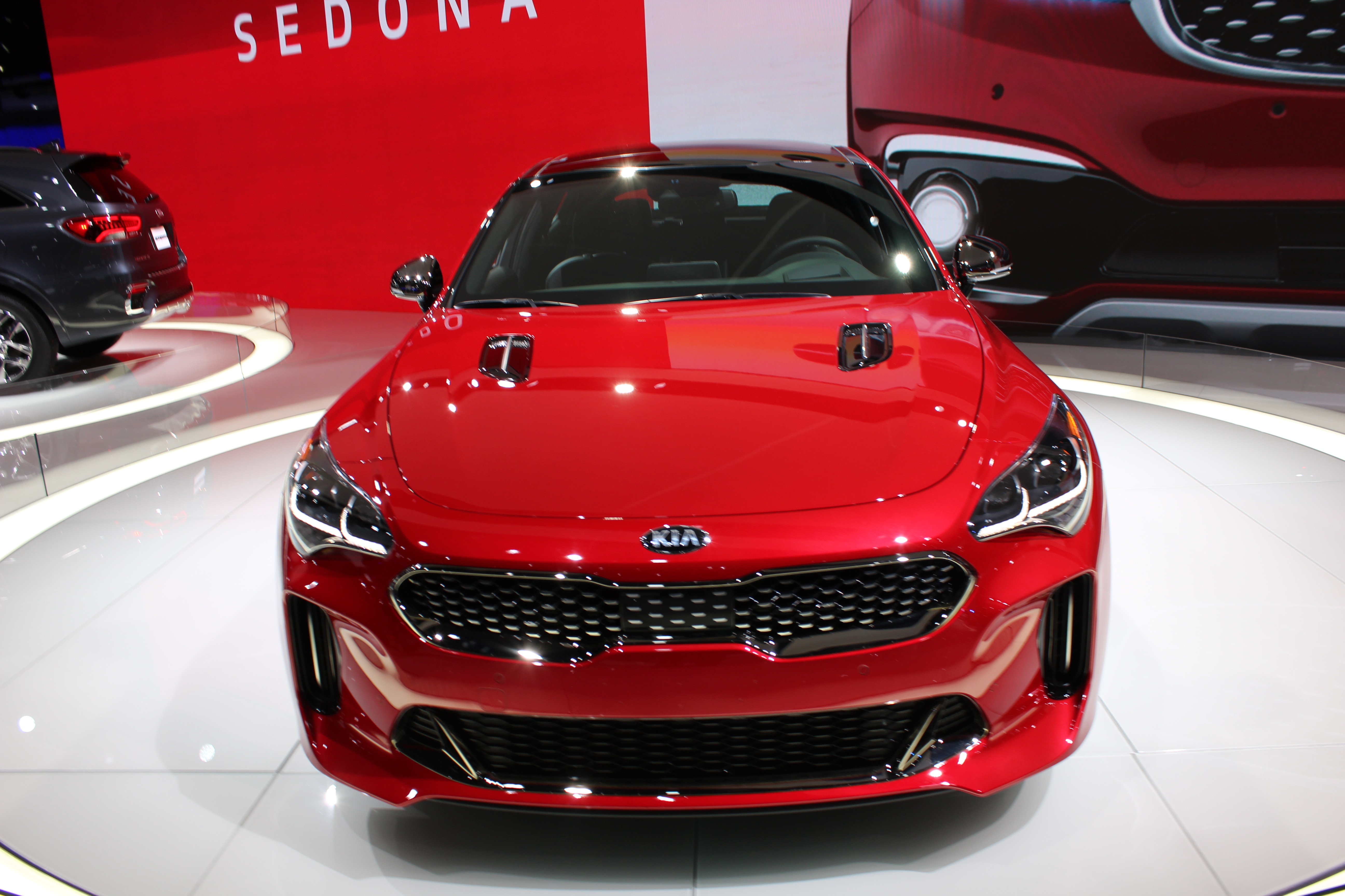 Red Car at the Auto Show